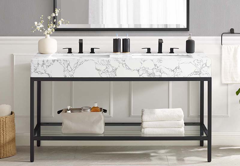 A bathroom vanity with a marble top and a mirror.