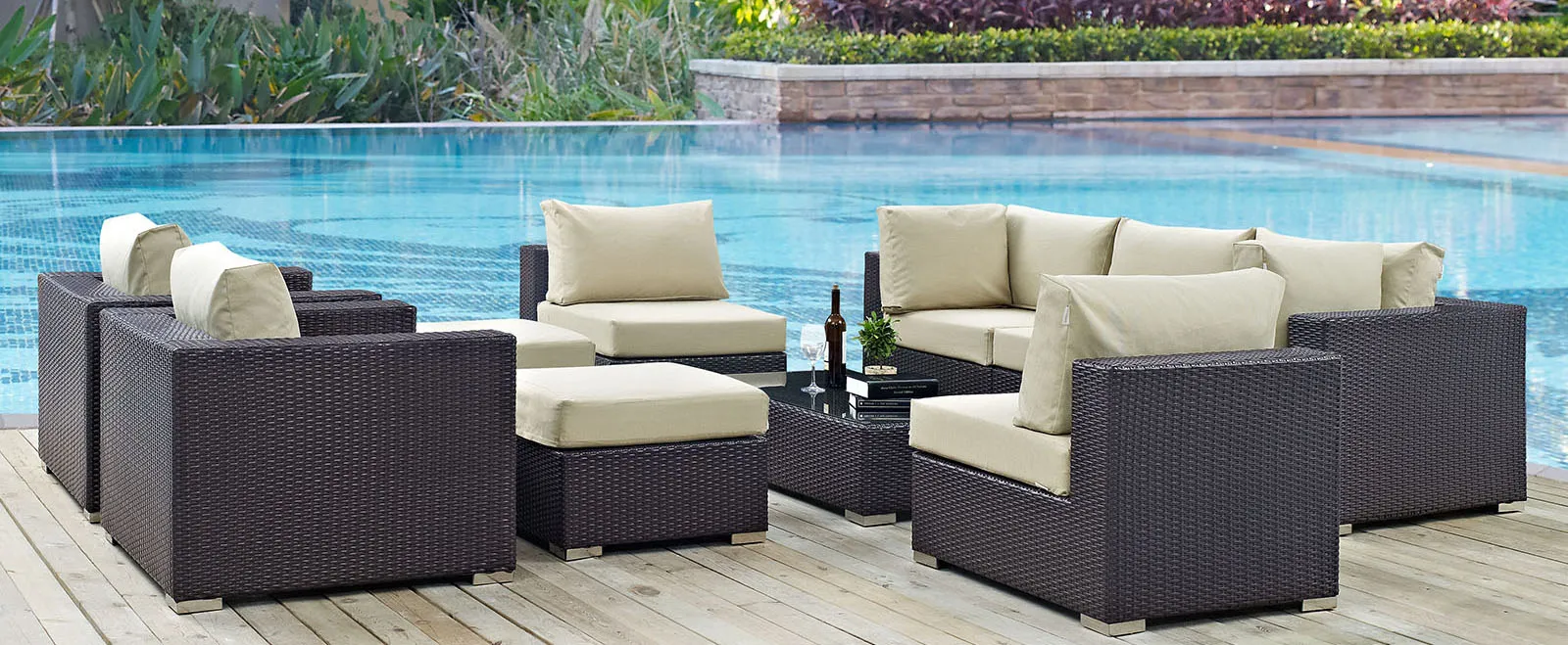 Outdooor furniture set with ottomen, table, chairs, and couch.