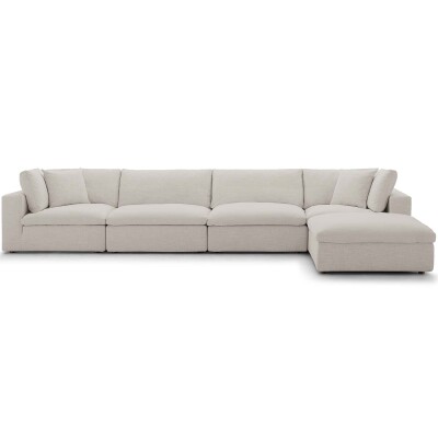 A white sectional sofa with a chaise.
