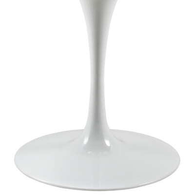 A white tulip table on a white pedestal.