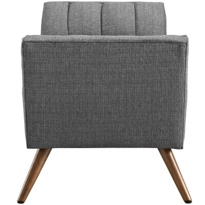A gray upholstered chair with wooden legs.