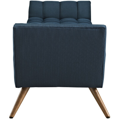 A blue upholstered sofa with wooden legs.