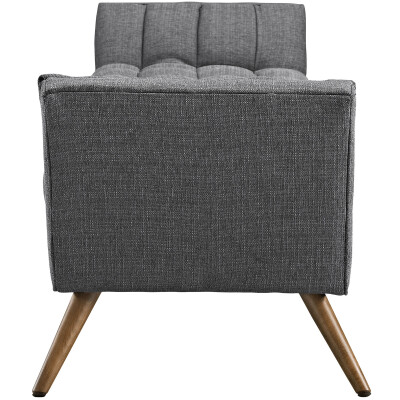 A gray upholstered sofa with wooden legs.