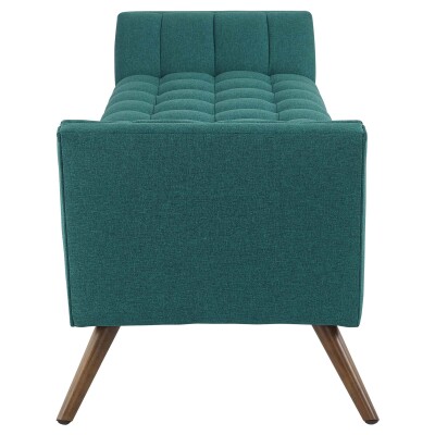A teal upholstered bench with wooden legs.