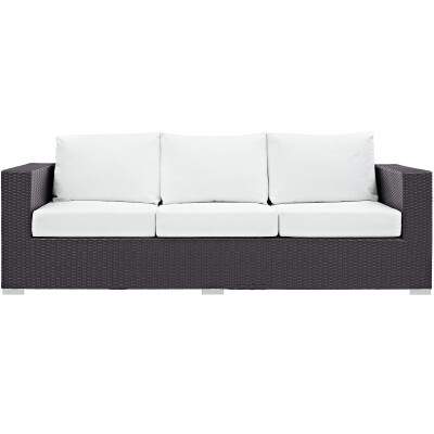A black and white wicker sofa on a white background.