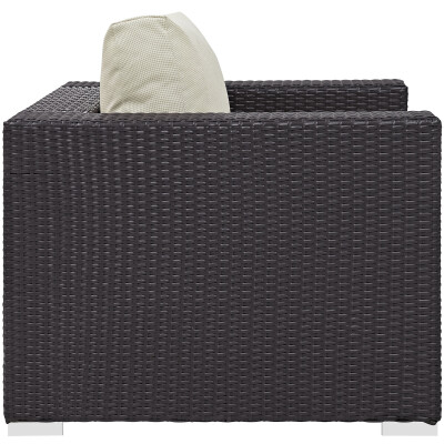 A black wicker lounge chair on a white background.