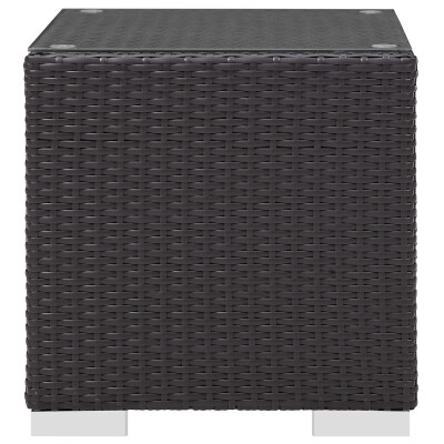 A black wicker side table on a white background.