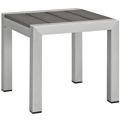 An outdoor side table with a grey slatted top.