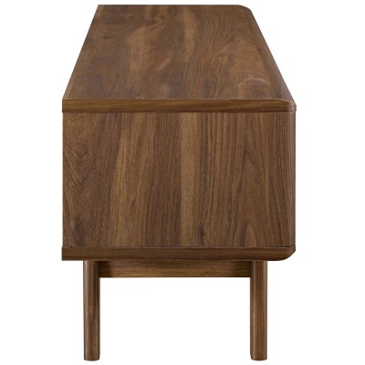 A modern sideboard with wooden legs and a wooden top.
