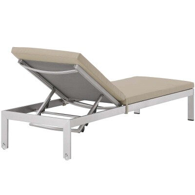 A chaise lounger with a beige cushion on a white background.
