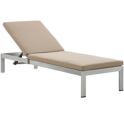A chaise lounger with a tan cushion on a white background.