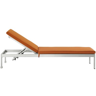 An orange chaise lounge on a white background.