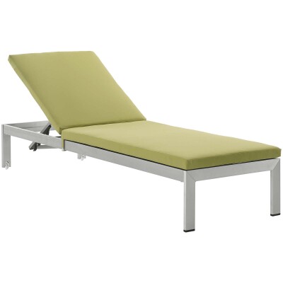 A green chaise lounger on a white background.