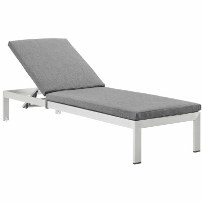 A grey and white chaise lounger on a white background.