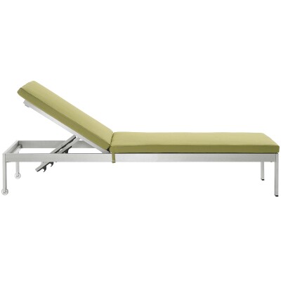 A green chaise lounge on a white background.