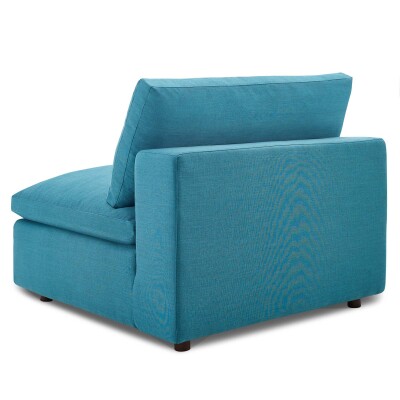 A teal upholstered chair with a back and armrest.