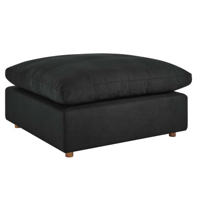 A black ottoman with a wooden base.