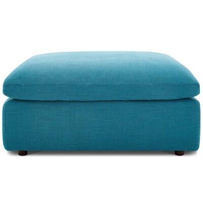 A teal ottoman on a white background.