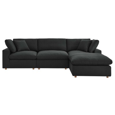 A black sectional sofa with a chaise.