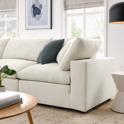 A white sectional sofa in a living room.