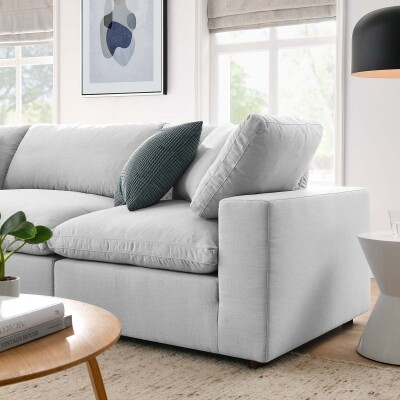 A white sectional sofa in a living room.