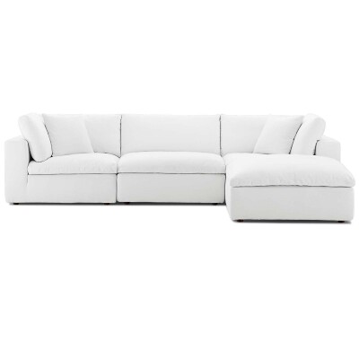 A white sectional couch on a white background.