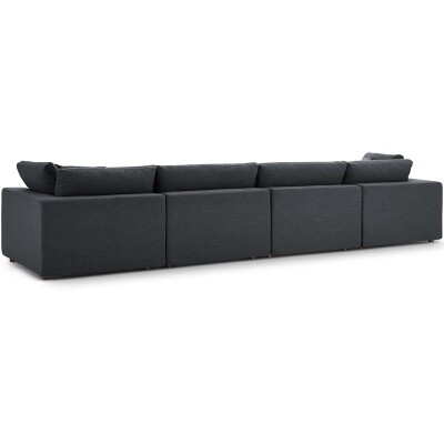 A black sectional sofa with a black cushion.