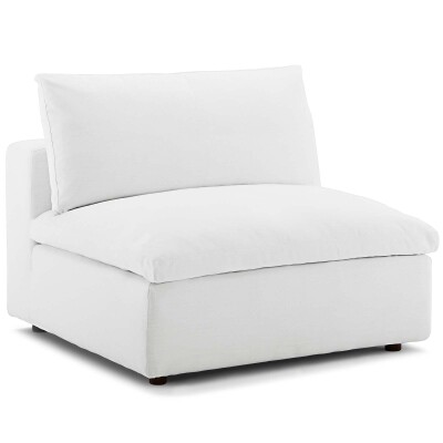 A white couch with a white cushion.