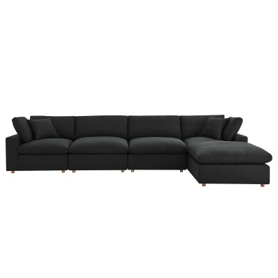 A black sectional sofa with a chaise.
