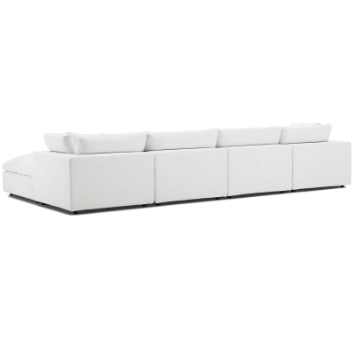 A white sectional sofa on a white background.