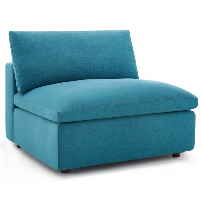 A teal upholstered chair on a white background.
