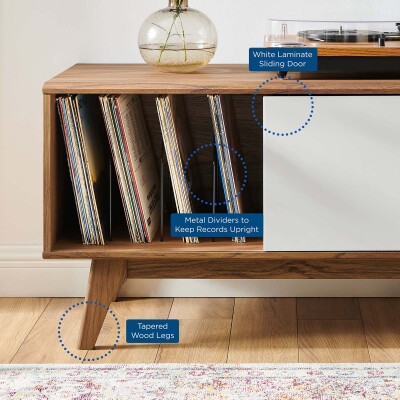 A wooden tv stand with a record player on it.