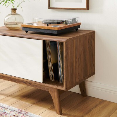 A wooden record player in a living room.