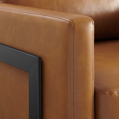 A tan leather chair with a black frame.