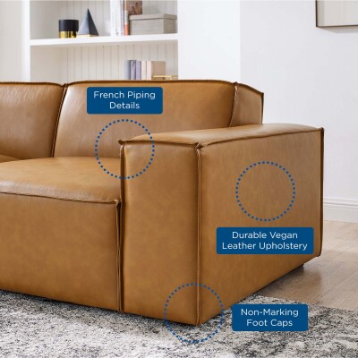 A tan leather sectional sofa with different features.