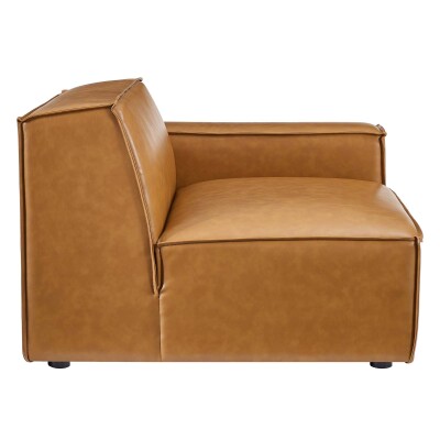 A tan leather lounge chair on a white background.