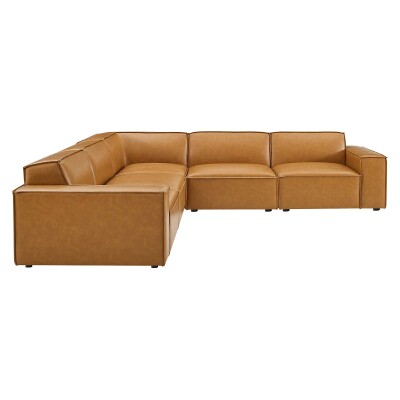 A tan leather sectional sofa on a white background.