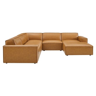 A tan leather sectional sofa with a chaise.