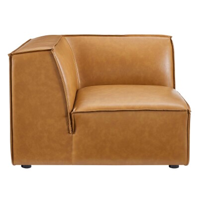 A tan leather corner chair on a white background.