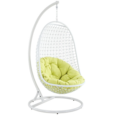 A white hanging chair with a green cushion.