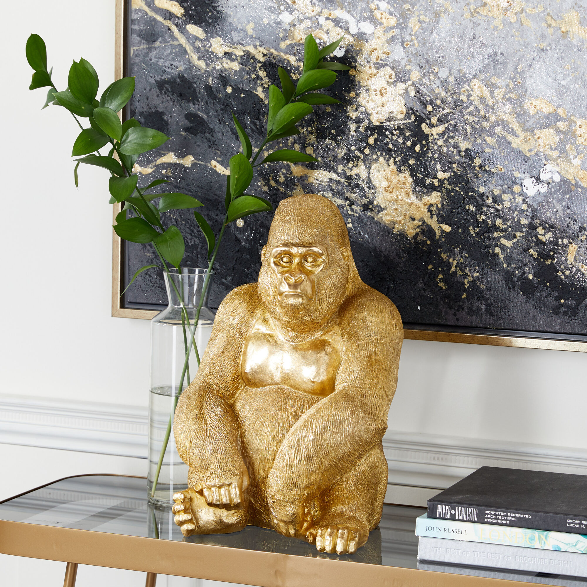 https://www.homethreads.com/files/uma/uma-607029-gold-polystone-traditional-sculpture-gorilla-1.jpeg