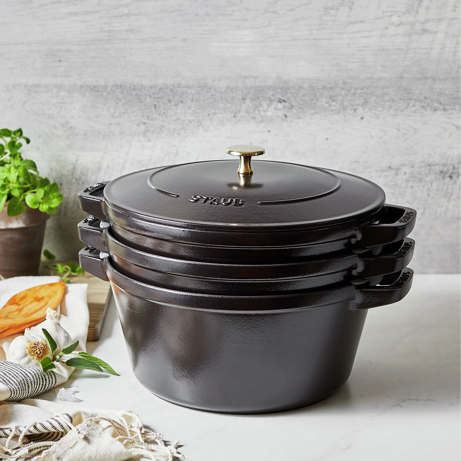 https://www.homethreads.com/files/zwilling/14552623-staub-cast-iron-set-4-pc-stackable-space-saving-cookware-set-dutch-oven-with-universal-lid-made-in-france-matte-black-15.webp