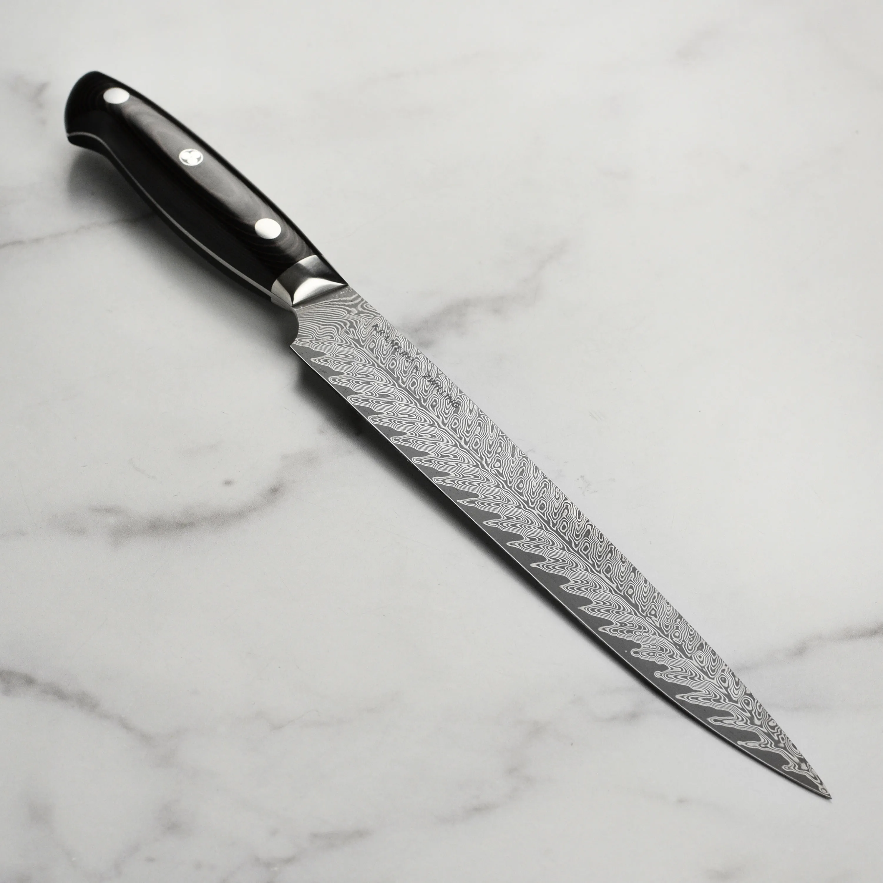 https://www.homethreads.com/files/zwilling/34890-233-kramer-by-zwilling-euroline-damascus-collection-9-inch-carving-knife-3.webp