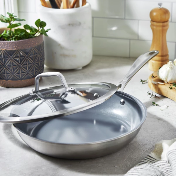 https://www.homethreads.com/files/zwilling/thumbs/1016715-zwilling-spirit-3-ply-95-inch-stainless-steel-ceramic-nonstick-fry-pan-with-lid-1.webp