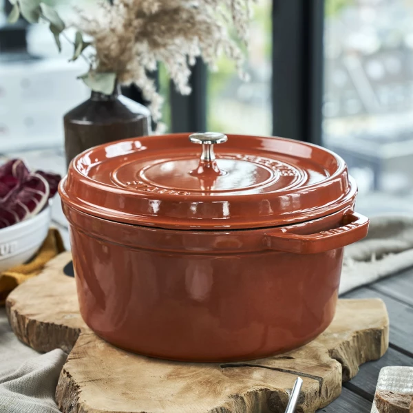 https://www.homethreads.com/files/zwilling/thumbs/11026806-staub-cast-iron-round-cocotte-dutch-oven-55-quart-serves-5-6-made-in-france-burnt-orange-6.webp
